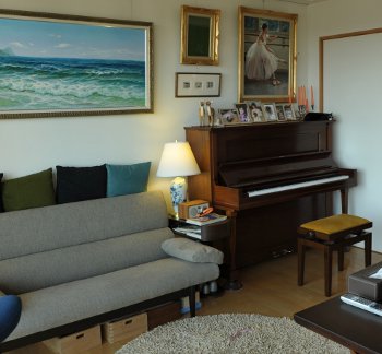  A typical living room in Monsey, with artwork & family photos on the walls and a well tuned upright piano in the corner, well-tuned and ready for a Monsey family to play.