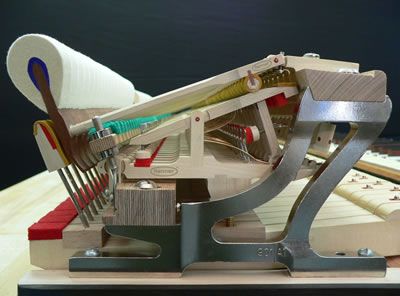 This is a side view of a grand piano action which has thousands of working parts, which need to be perfectly aligned and adjusted. As you can see, many of these parts are made of wood, which swells and shrinks according to the heat and humidity in the room. Is it any wonder that pianos go out of tune and need regular servicing?